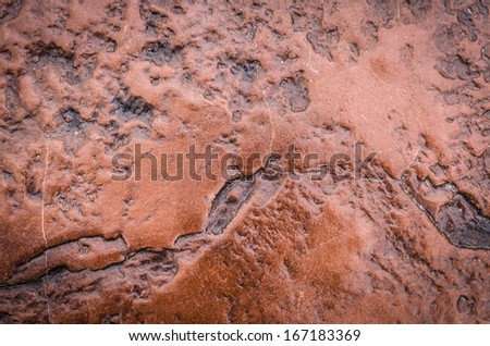 Glossy wall red stone texture background.