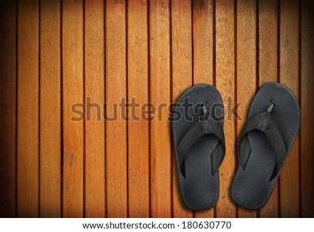 old black shoes on wooden background - square format