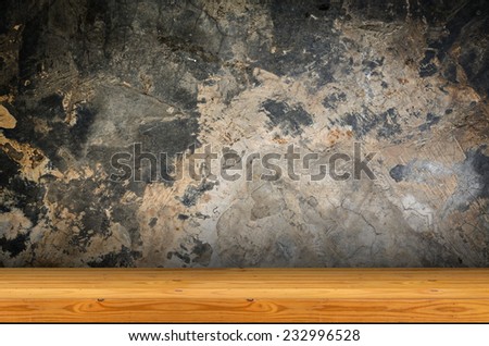 A front view of a regular cleared wooden shelf with wooden brackets grunge background with space for text or image,old dirty texture, grey wall background
