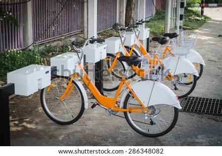 Chiang Mai 2015 public hire bike along with Barclays Bikes locked at the docking bays.
