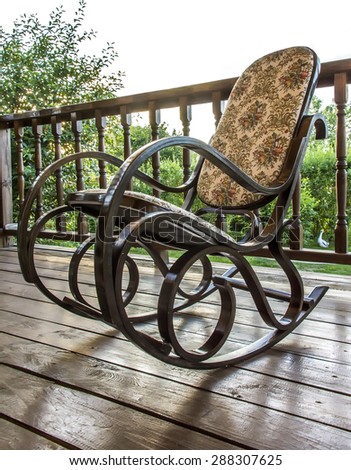 a rocking chair on the veranda