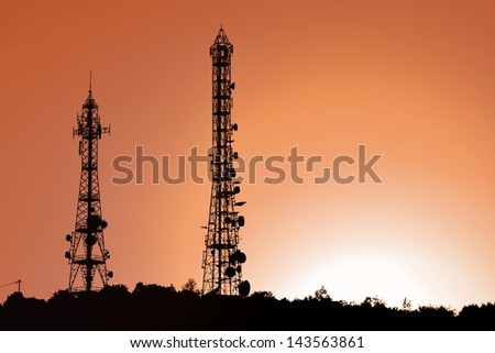 Antenna towers at sunset