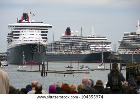 SOUTHAMPTON, UK - 5 JUNE: Three Queens - Cunard ships Queen Mary 2 & Queen Victoria meet in the port of Southampton to join the Queen Elizabeth to celebrate the Diamond Jubilee. 5 JUNE 2012