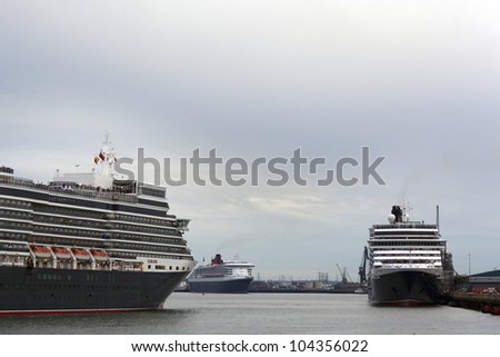SOUTHAMPTON, UK - 5 JUNE: Three Queens - Cunard ships Queen Mary 2 & Queen Victoria meet in the port of Southampton to join the Queen Elizabeth to celebrate the Diamond Jubilee. 5 JUNE 2012