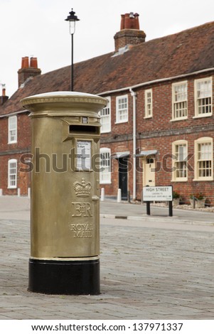 HAMBLE, NR SOUTHAMPTON, UK - AUG 8 : UK's Royal Mail honours Olympic Gold Medal winners, by transforming a post box from red to gold in the home town of each gold medallist. 8 Aug 2012