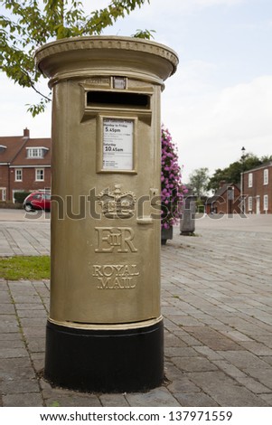 HAMBLE, NR SOUTHAMPTON, UK - AUG 8 : UK Royal Mail honours Olympic Gold Medal winners, by transforming a post box from red to gold in the home town of each gold medalist. 8 Aug 2012