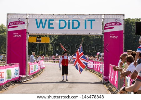 SOUTHAMPTON, UK - 14 JULY 2013 - Town crier starts the annual women\'s Race for Life to raise money for Cancer Research. 14 July 2013, Southampton, UK