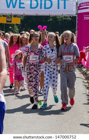 SOUTHAMPTON, UK - JULY 14: Women and unidentified children gather for the annual Race for Life to raise money for Cancer Research on July 14, 2013 in Southhampton, UK.