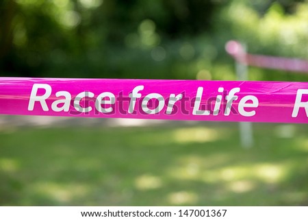 SOUTHAMPTON, UK - JULY 14: Starting tape for the annual Race for Life to raise money for Cancer Research on July 14, 2013 in Southhampton, UK.