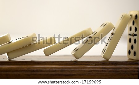 Close up of line of dominoes falling down