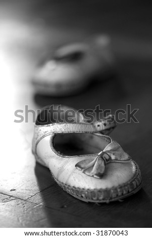 A pair of worn out baby shoes. Nostalgic image suitable for Mothers Day/Fathers Day/Grandparents Day