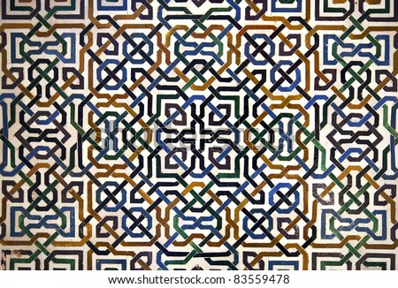Detailed background  of the intricate tile patterns on a wall of the Nasrid Palace, Alhambra, Granada, Spain
