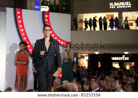 SOUTHAMPTON, UK - SEPT. 22: Gok Wan prepares to announce the winners of his high street challenge from the catwalk of the West Quay Shopping Centre during filming of his television show \