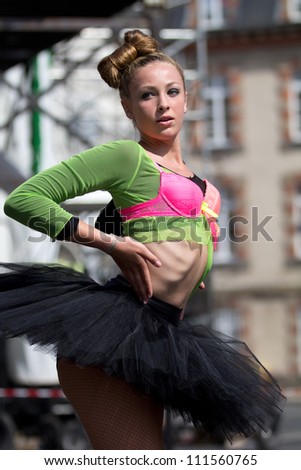 AURILLAC, FRANCE - AUGUST 22 :Dancer wearing a tutu, as part of the Aurillac International Street Theater Festival, show by the Ballets Temps Dance Jr Cie , on august 22, 2012, in Aurillac,France.