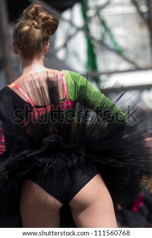 AURILLAC, FRANCE - AUGUST 22 : Dancer , from the back, as part of the Aurillac International Street Theater Festival, show by the Ballets Temps Dance Jr Cie , on august 22, 2012, in Aurillac,France.