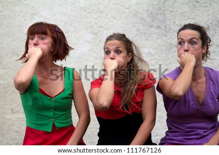 AURILLAC, FRANCE - AUGUST 24 : Funny faces of three women as part of the Aurillac International Street Theater Festival,show by the Company D\'Akipaya Danza , on august 24, 2012, in Aurillac,France.