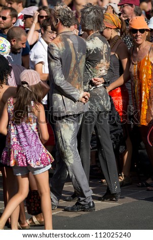 AURILLAC, FRANCE - AUGUST 22: zombies walking in the middle of the crowd as part of the Aurillac International Street Theater Festival,show by the Company nÃ?Â°8 ,on august 22, 2012, in Aurillac,France.