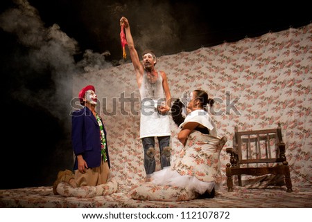 AURILLAC, FRANCE - AUGUST 22: actors under a big top as part of the Aurillac International Street Theater Festival,show by the Company Off ,on august 22, 2012, in Aurillac,France.