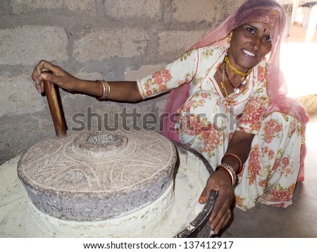 GHANERAO ,  INDIA - MARCH 10: closeup portrait of a Bishnoi woman turning a millstone, on March 10, 2013, Ghanerao, India. Bishnois are known as the first environment conservationists in the world.