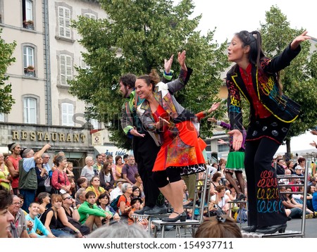 Aurillac, France - August 23: Actors Perched On Bar Stools In The Middle Of The Crowd,As Part Of The Aurillac International Street Theater Festival, Cie Oposito,On August 23, 2013, In Aurillac,France