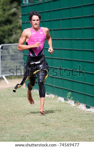 AUCH, FRANCE -  SEPTEMBER 4: Auch triathlon, male runner in the transition area after the swim race, on September 4, 2010, in Auch, France.