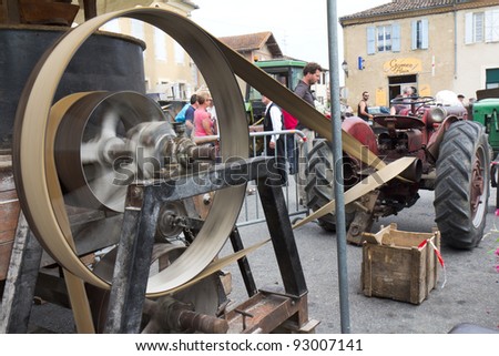 SEISSAN, FRANCE - AUGUST 5: Big agricultural machine belt in motion at \