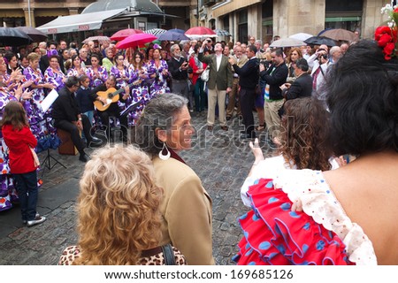 UBEDA, SPAIN -  SEPTEMBER 29: a man is singing in the middle of the crowd during the celebrations of the San Miguel, on September 29, 2013, in Ubeda, Spain.