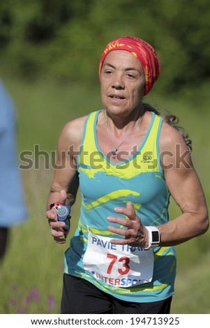 PAVIE, FRANCE - MAY 18:  Motivated old runner wearing a red bandana at the Trail of Pavie, on May 18, 2014, in Pavie, France