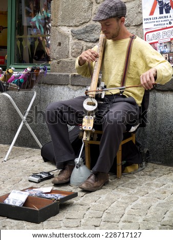 AURILLAC, FRANCE, AUGUST 19: Rustic instrument for an anonymous street musician as part of the Aurillac international Street Theater Festival, on august 19, 2014 in Aurillac, France.