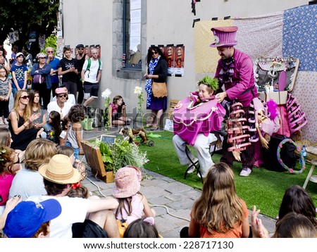 AURILLAC, FRANCE, AUGUST 21: creative hairdresser makes a new hairstyle with natural plants as part of the Aurillac International Street Theater Festival, on august 21, 2014 in Aurillac, France.