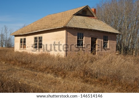 An old abandoned rural school in fall
