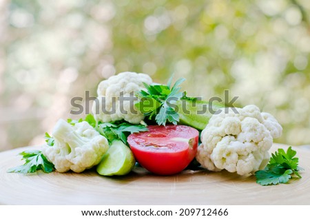 mixed vegetables cauliflower, cucumbers, tomatoes and herbs