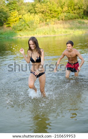 guy and girl having fun runs out of water