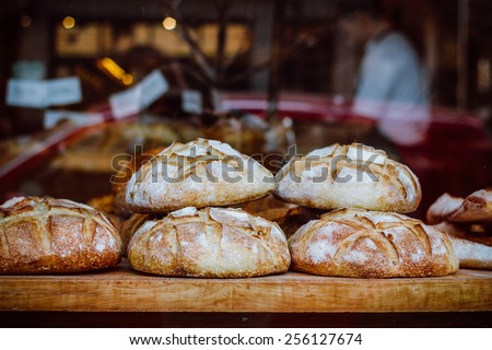 Window of bakery with fresh breads view from the street.