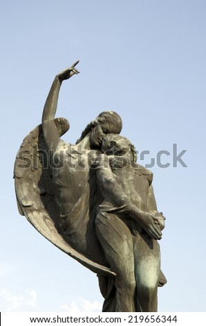 SPISSKE PODHRADIE, SLOVAKIA - AUGUST 10, 2014: The angel takes the soul to heaven. The bronze sculpture by Alexej (Elek) Lux (1883-1941) on the grave monument of Jan Harmatta and his wife.