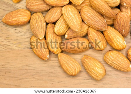 Raw Almonds on Aged Wood. Healthy Dried Almond Nuts.