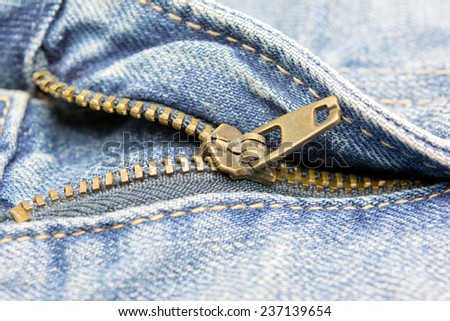 Blue jeans zipper. Close up shooting