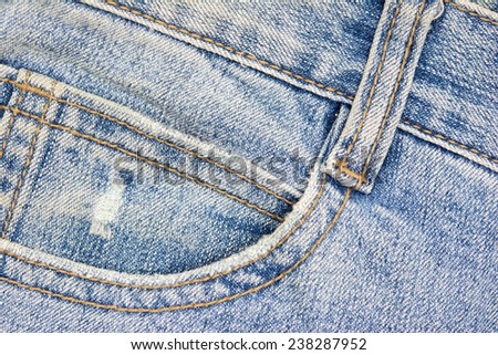 close up up of fancy washed blue jeans pocket