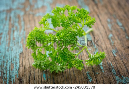 fresh parsley on a wooden garden board.