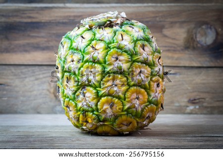 Pineapple on wooden.