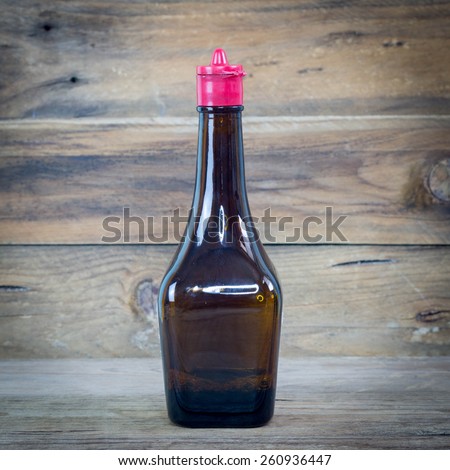 soy sauce bottle on wood.