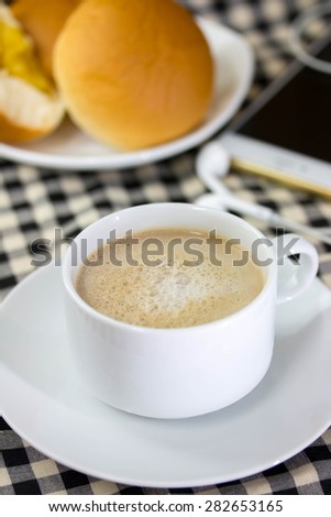 a cup coffee and bread