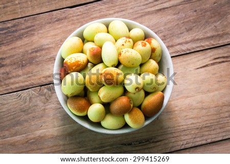 chinese jujubes fruits on wooden background