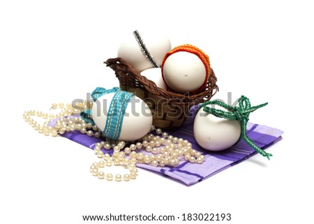 Easter holiday. Easter eggs with colored ribbon. Photo.