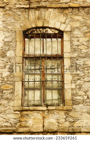old window with rock wall