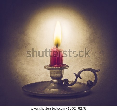 Wax candle on an old candelabrum