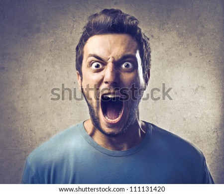 Portrait of a young man screaming
