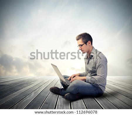 Man Using His Laptop Computer