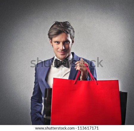 Gentleman holding some shopping bags