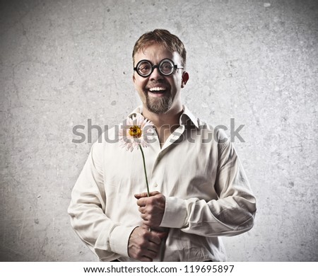 Smiling man with a sunflower